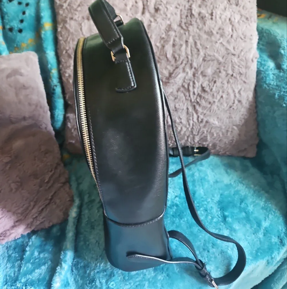 AS-IS Kate Spade black leather backpack LEFT STRAP AT THE TOP TORN. STILL NEW